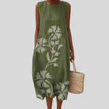 Olivgrünes Kleid mit Blütenzweig