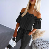 Nikola – Eleganter Jumpsuit mit schulterfreien Trägern und Taillierung